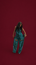 our model is wearing the Verde two piece Set in a burgundy background
